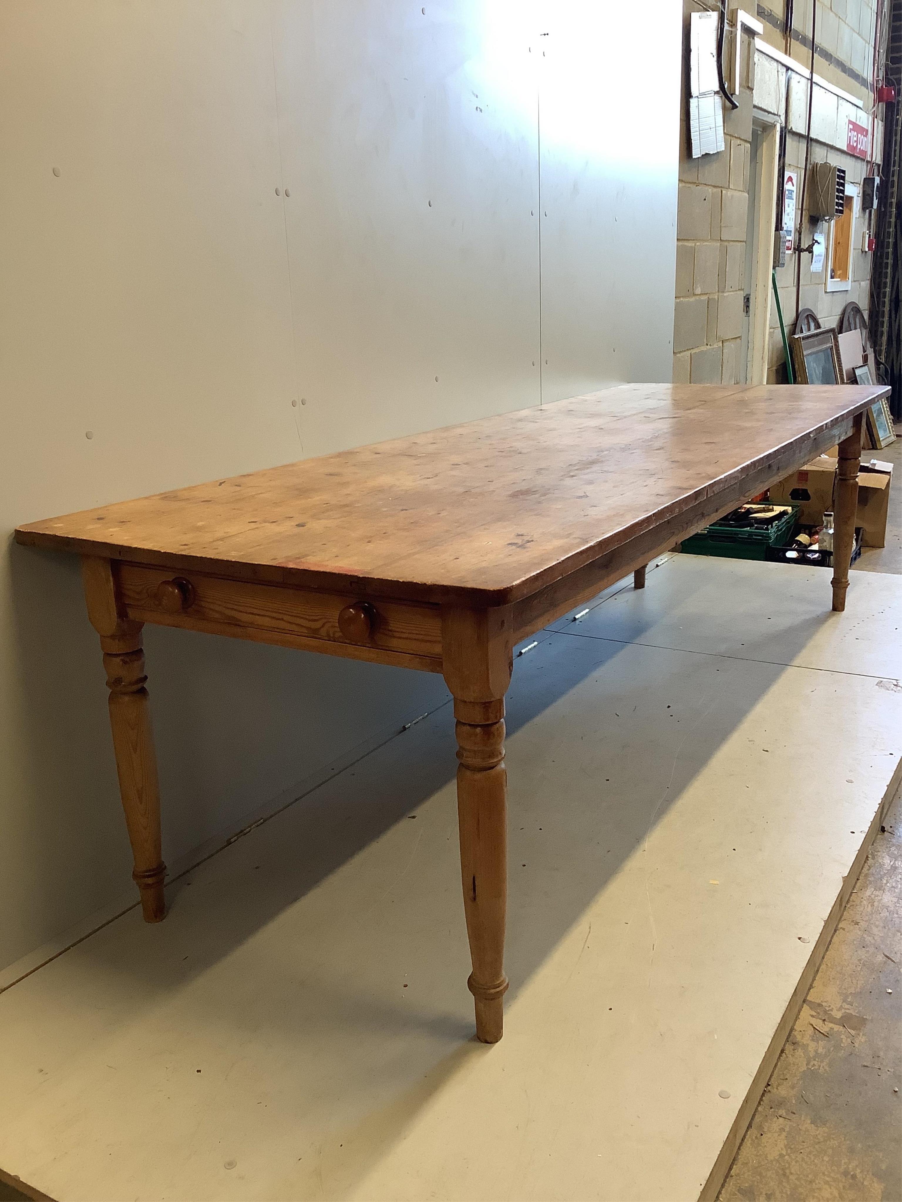 A Victorian rectangular pine kitchen table, fitted two drawers, width 275cm, depth 92cm, height 75cm. Condition - fair to good